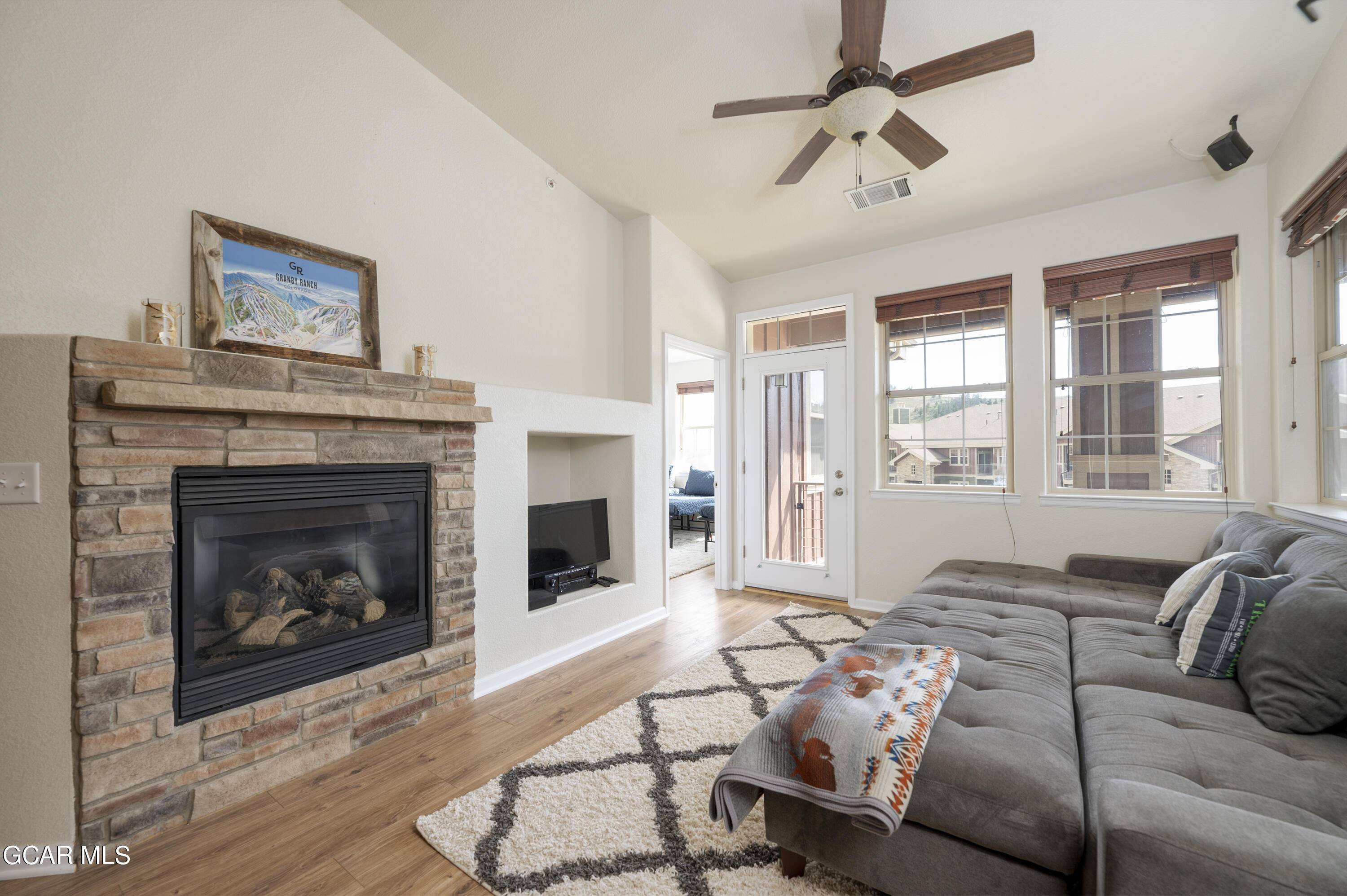 152 Village Road, Unit B306 Granby, CO 80446 - Photo 1 of 32 a living room with furniture and a fireplace