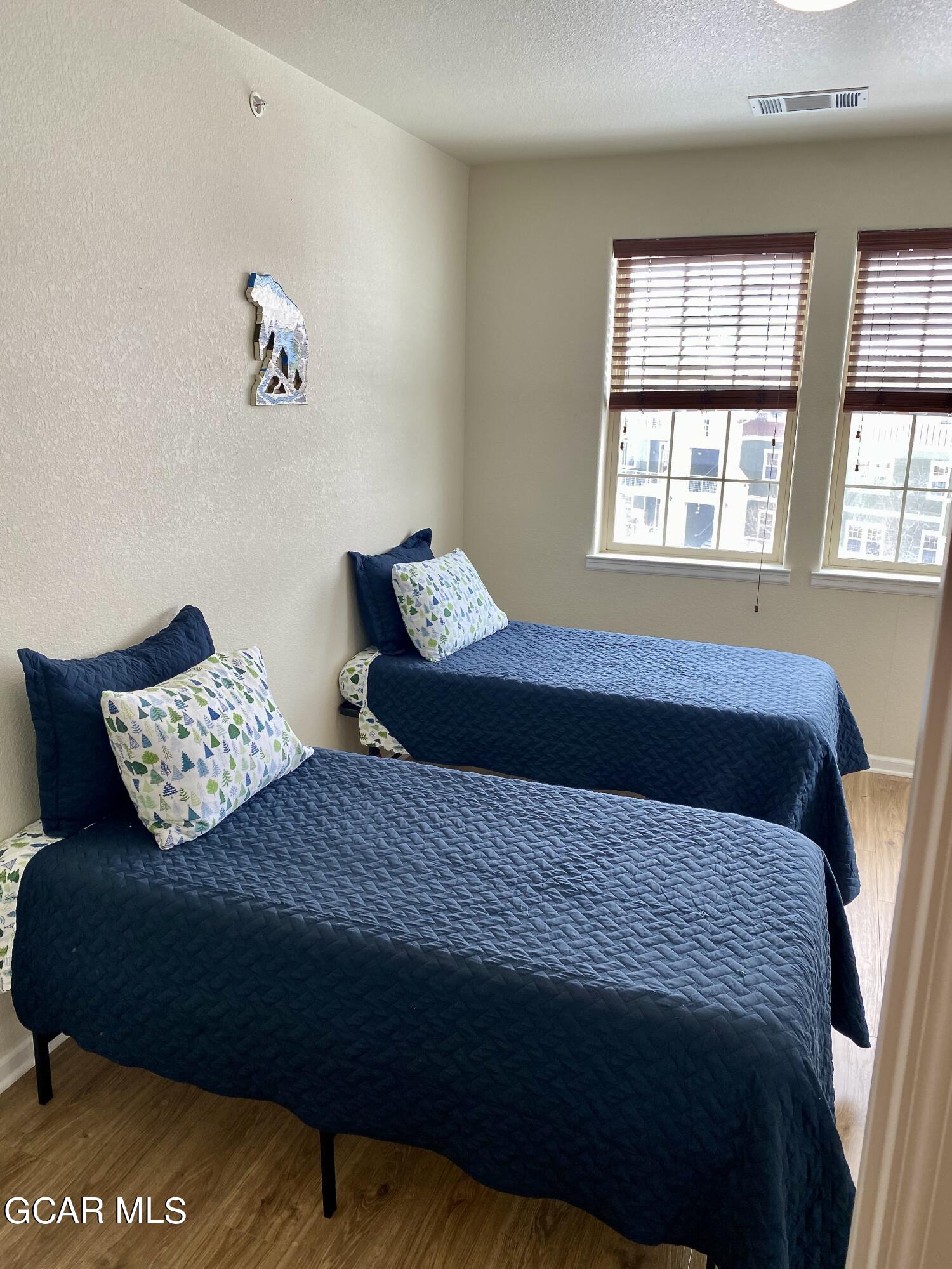 152 Village Road, Unit B306 Granby, CO 80446 - Photo 15 of 32 a bedroom with a bed and window