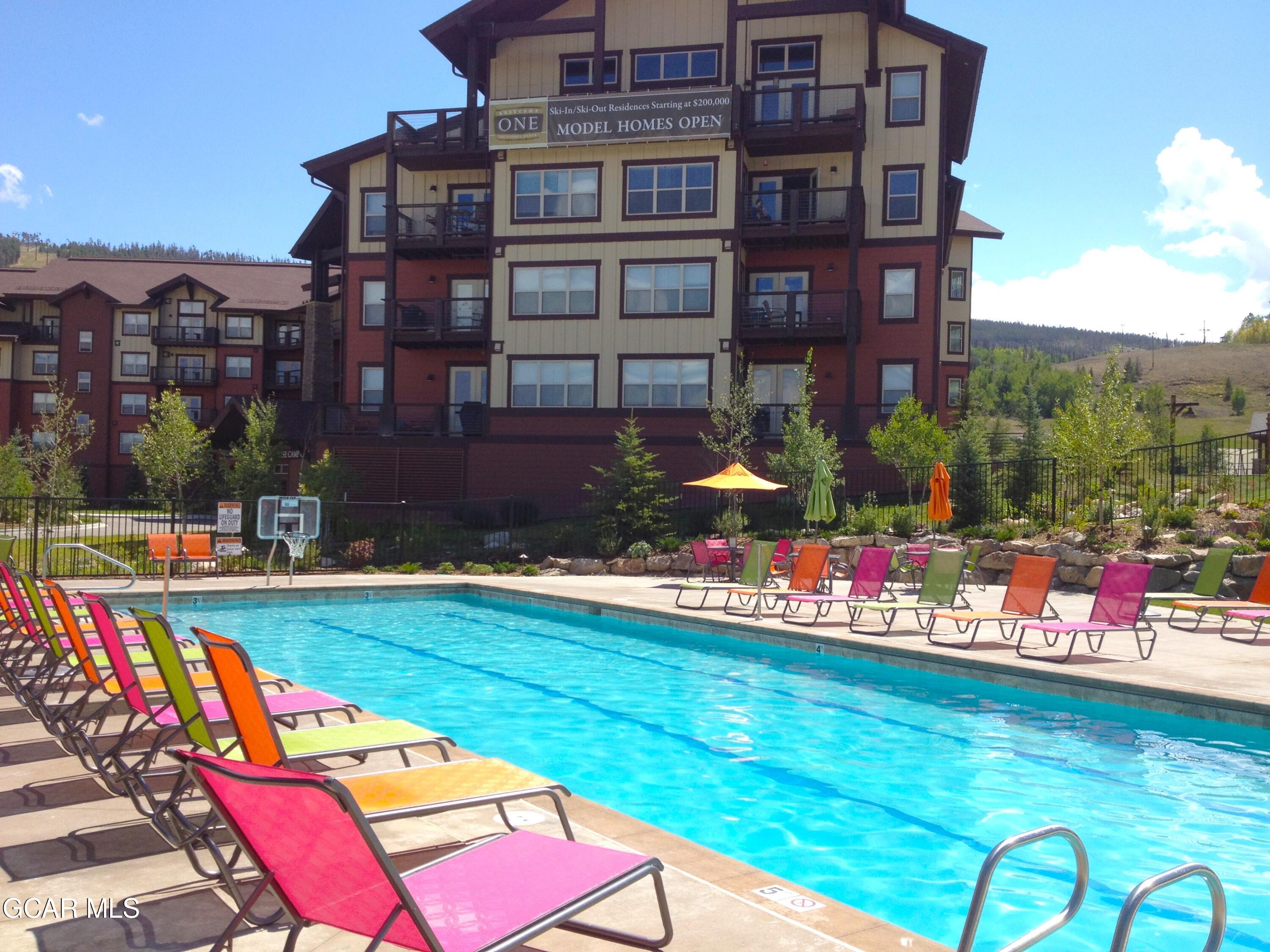 152 Village Road, Unit B306 Granby, CO 80446 - Photo 27 of 32 a view of swimming pool with a yard and sitting area
