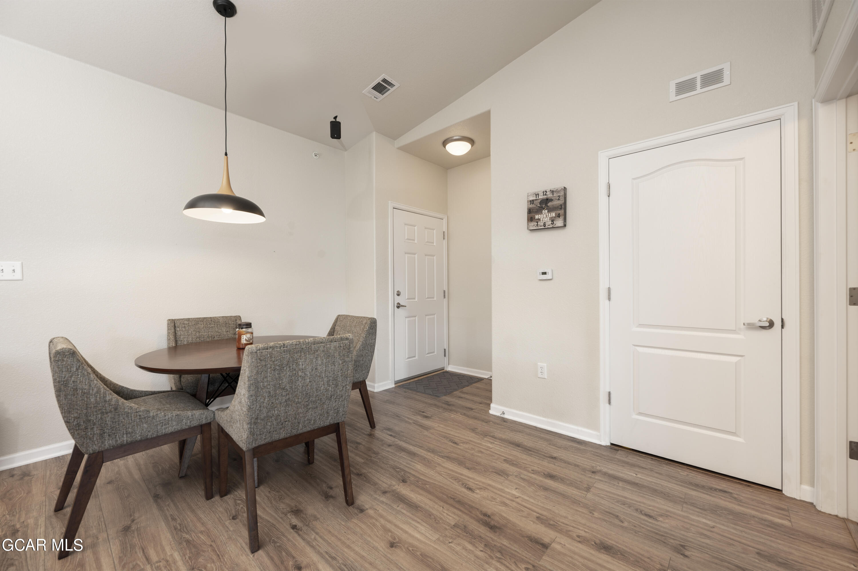 152 Village Road, Unit B306 Granby, CO 80446 - Photo 7 of 32 a dining room with furniture and wooden floor