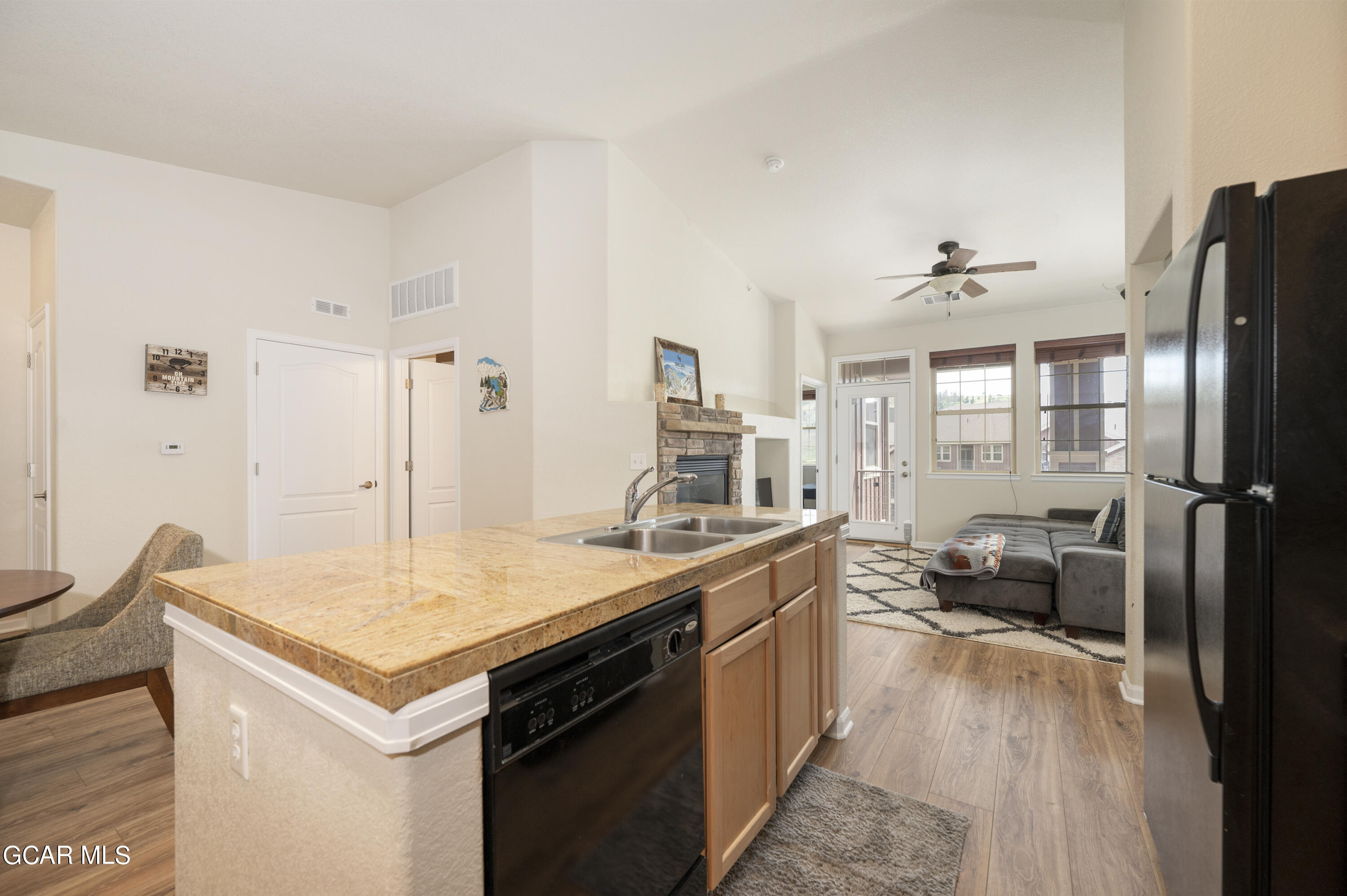 152 Village Road, Unit B306 Granby, CO 80446 - Photo 8 of 32 a kitchen with a refrigerator and countertop
