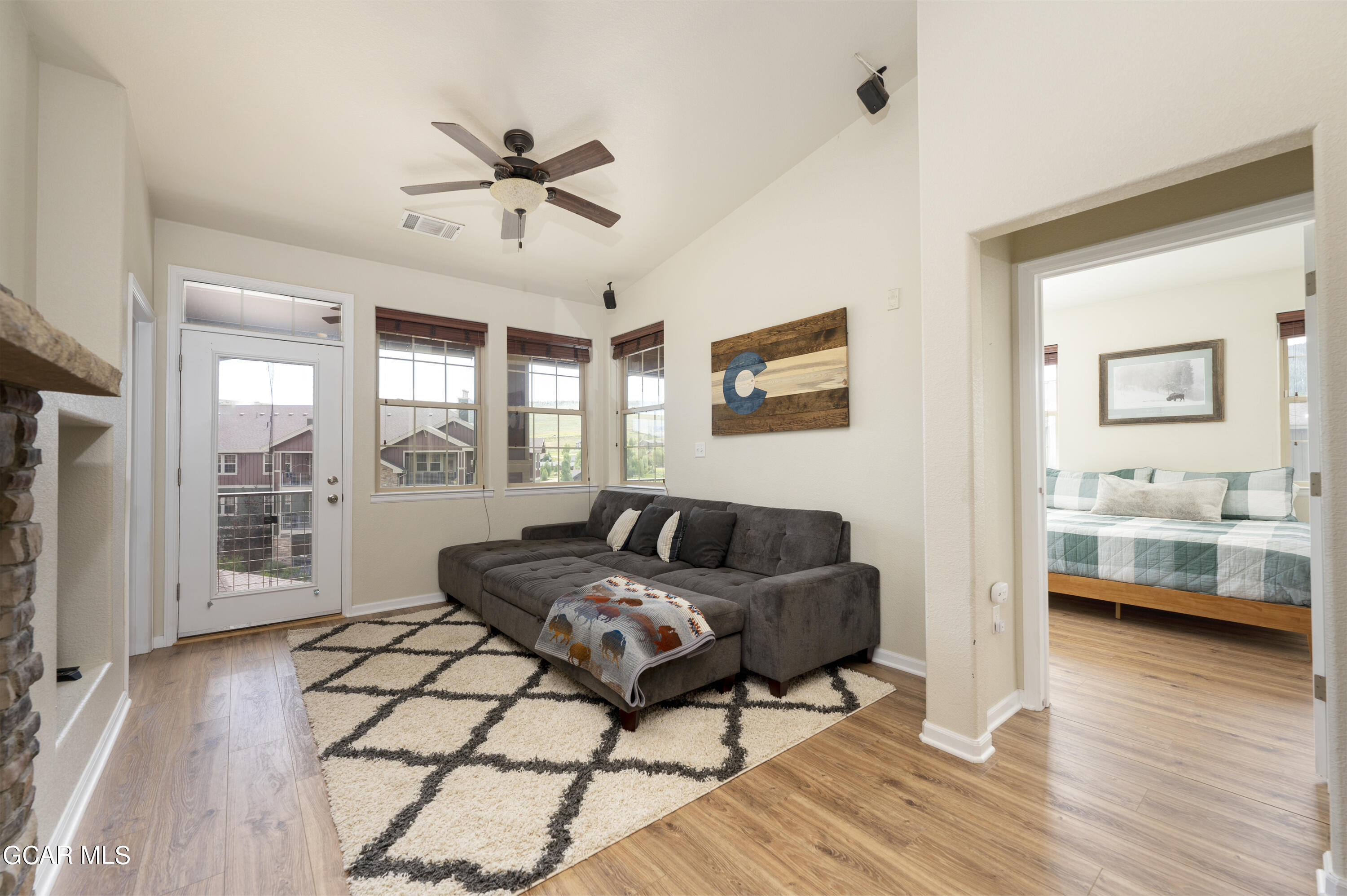 152 Village Road, Unit B306 Granby, CO 80446 - Photo 9 of 32 a living room with furniture and a wooden floor