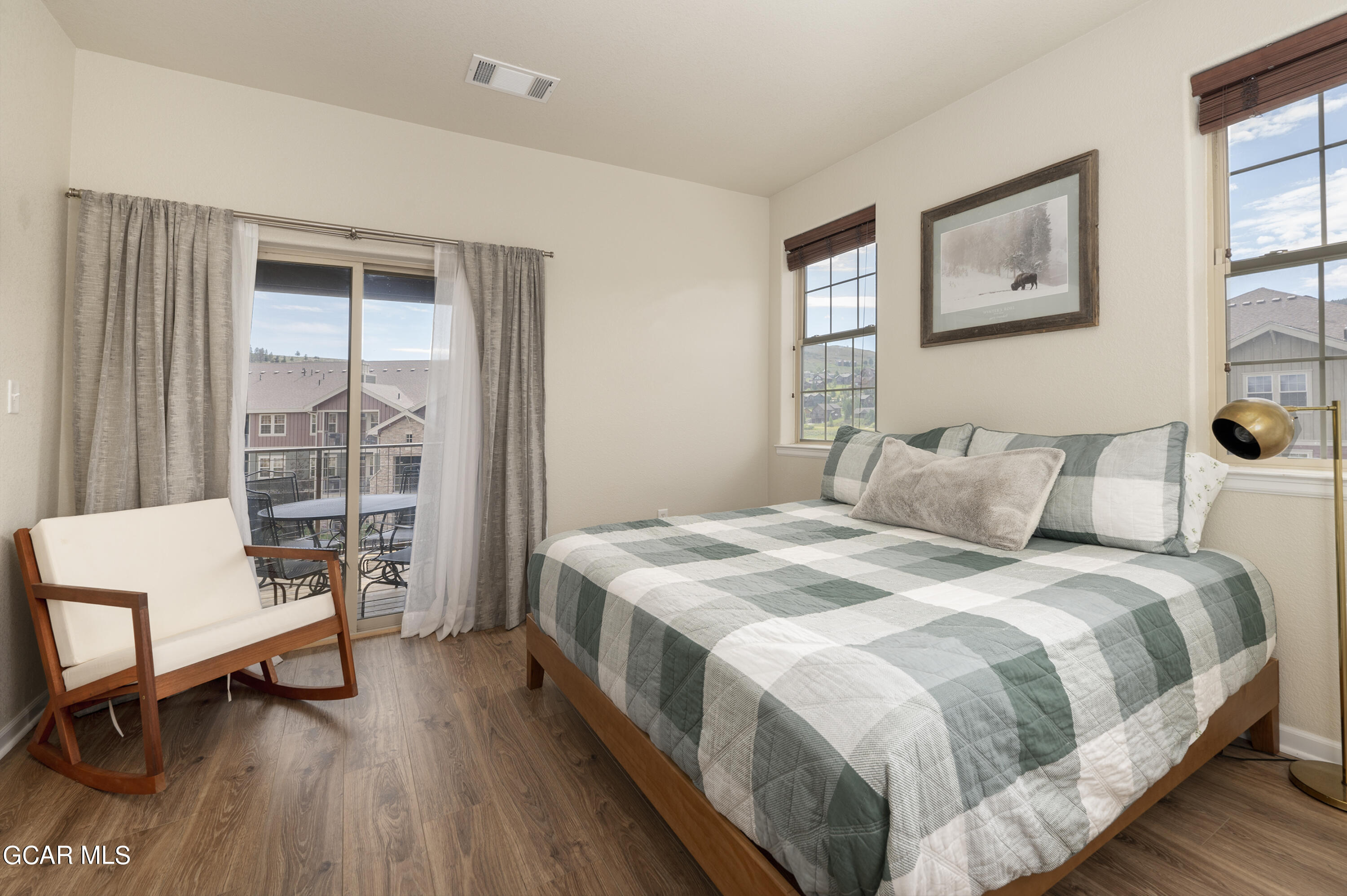 152 Village Road, Unit B306 Granby, CO 80446 - Photo 10 of 32 a bedroom with bed and wooden floor