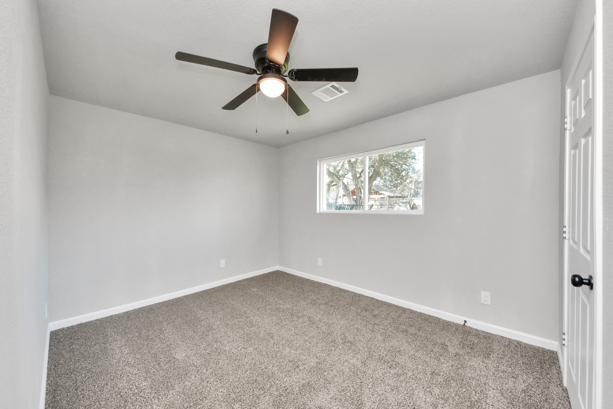15123 Kaler Road Houston, TX 77060 - Photo 11 of 24 wooden floor in an empty room with a window