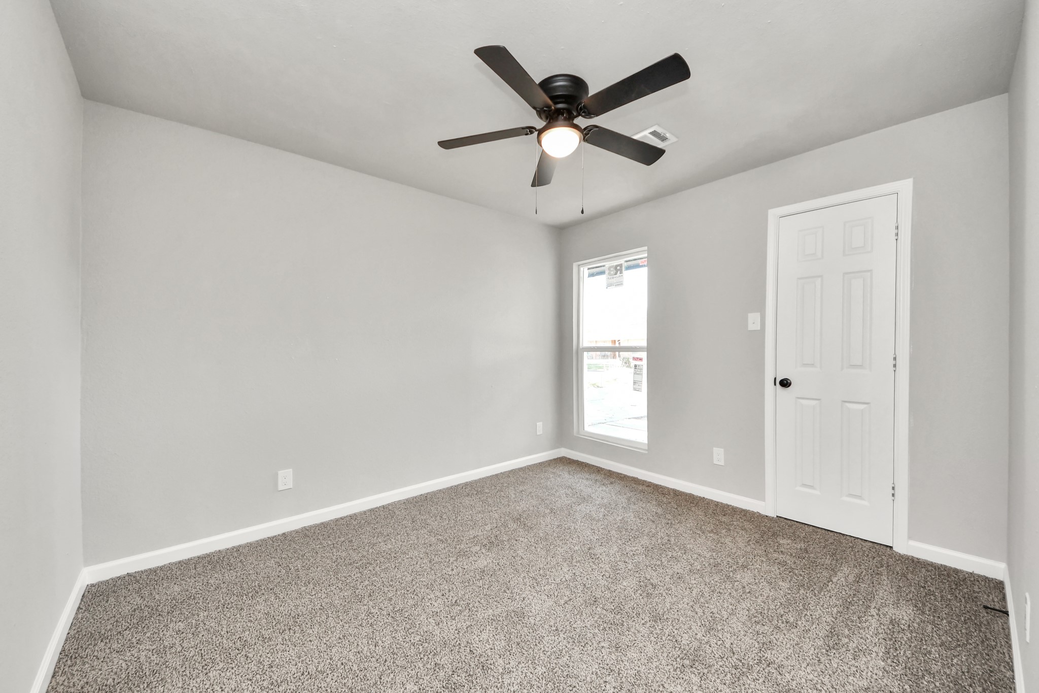 15123 Kaler Road Houston, TX 77060 - Photo 14 of 24 a view of a big room with wooden floor and windows