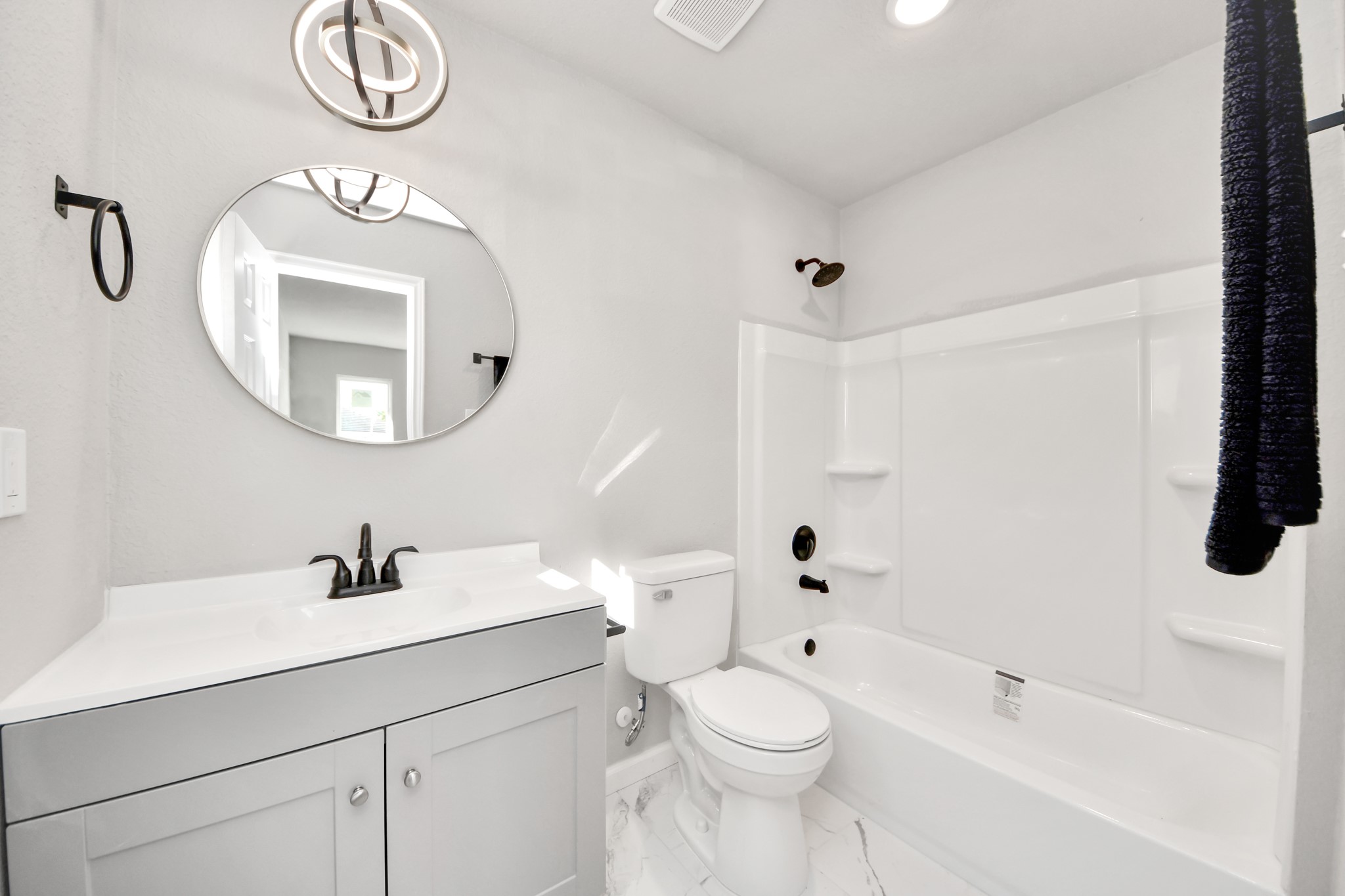 15123 Kaler Road Houston, TX 77060 - Photo 17 of 24 a bathroom with a sink a toilet and a mirror