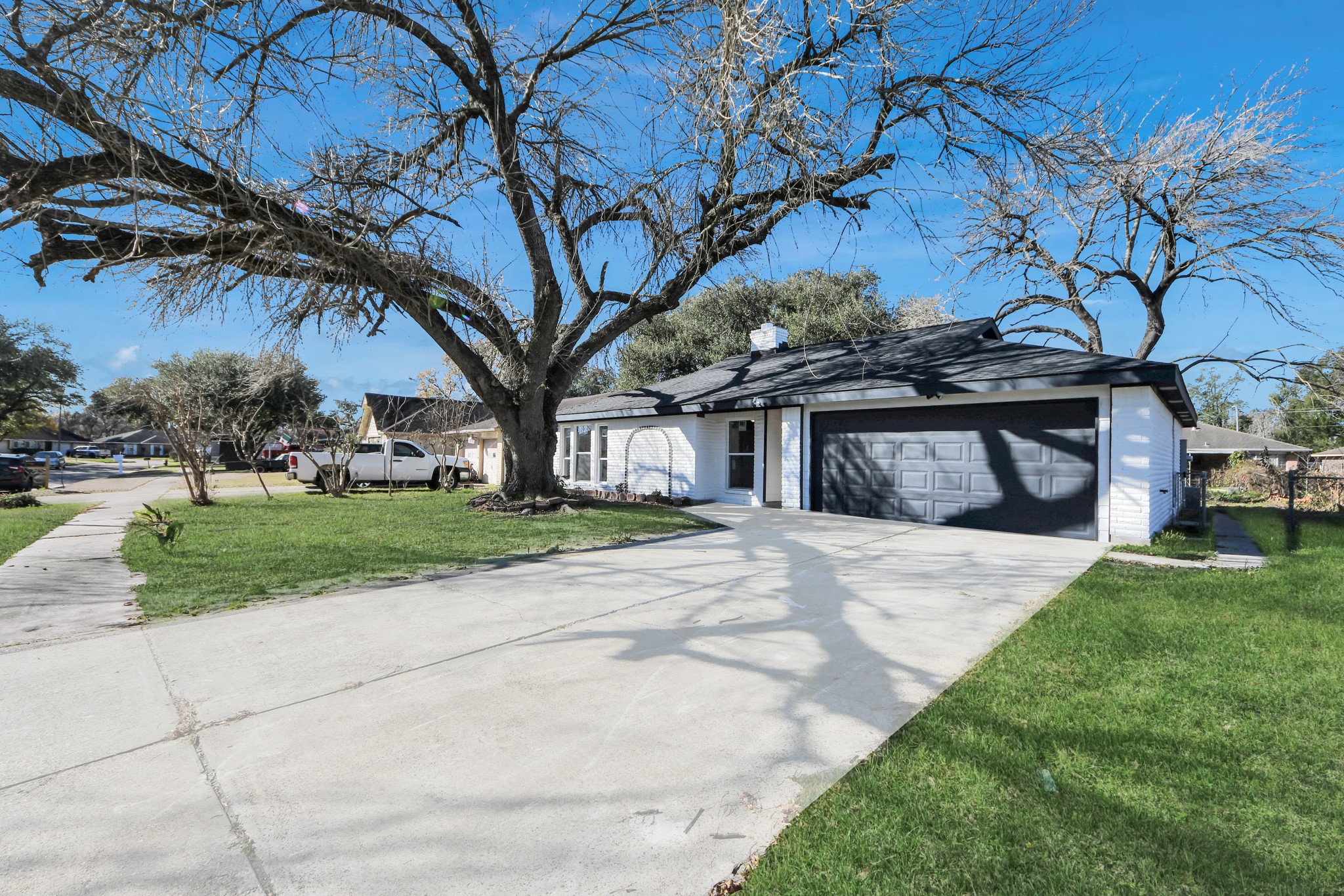 15123 Kaler Road Houston, TX 77060 - Photo 20 of 24 a front view of a house with a yard and garage