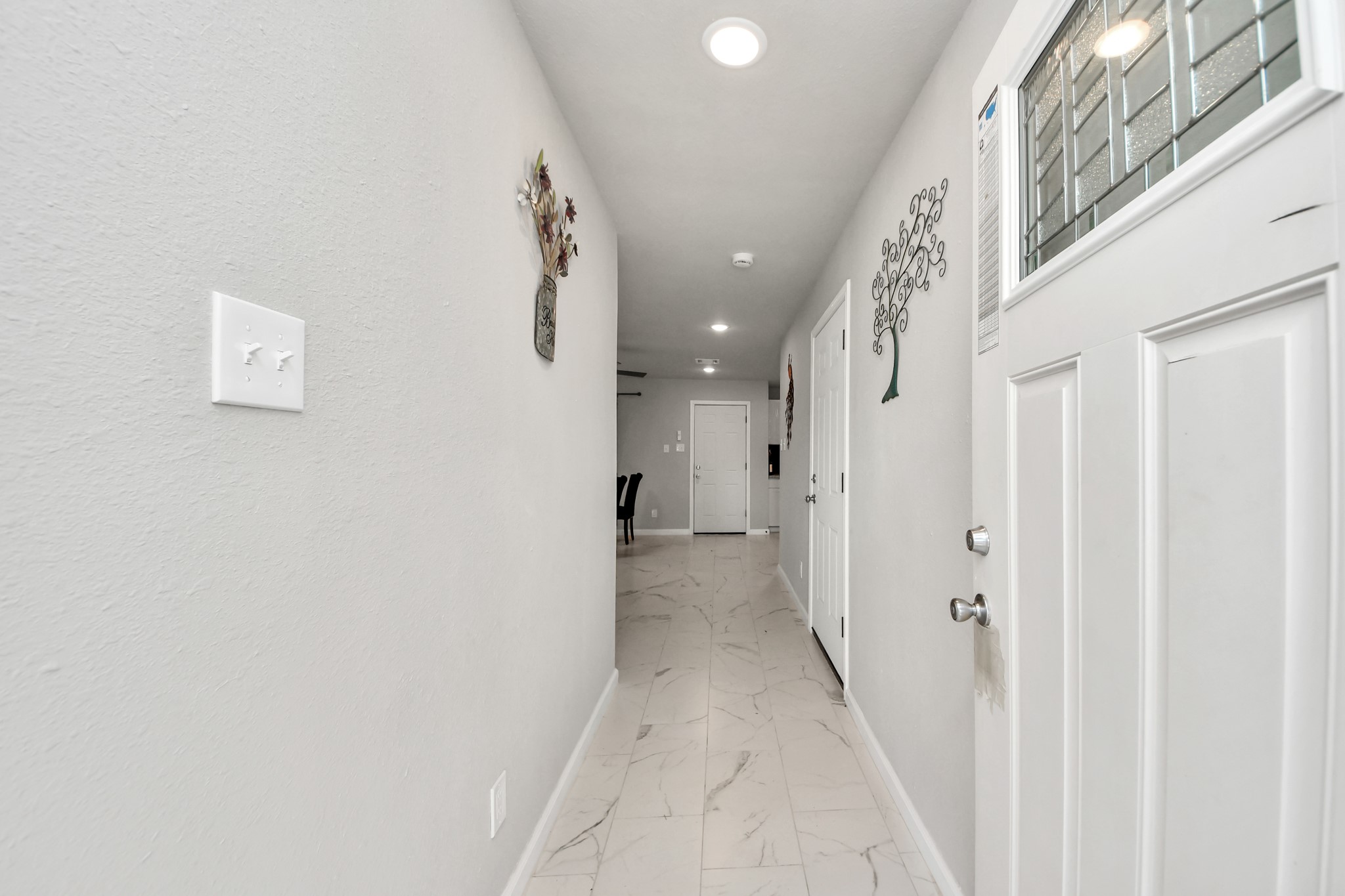 15123 Kaler Road Houston, TX 77060 - Photo 2 of 24 a view of a hallway with a white walls