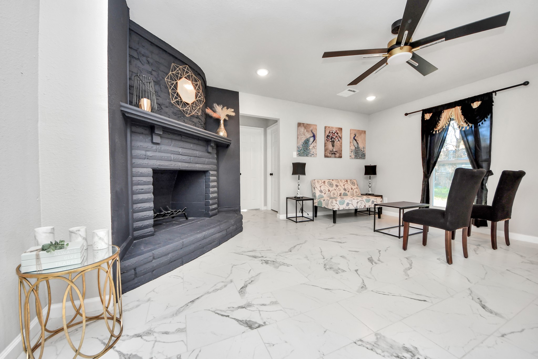 15123 Kaler Road Houston, TX 77060 - Photo 3 of 24 a living room with furniture and a fireplace