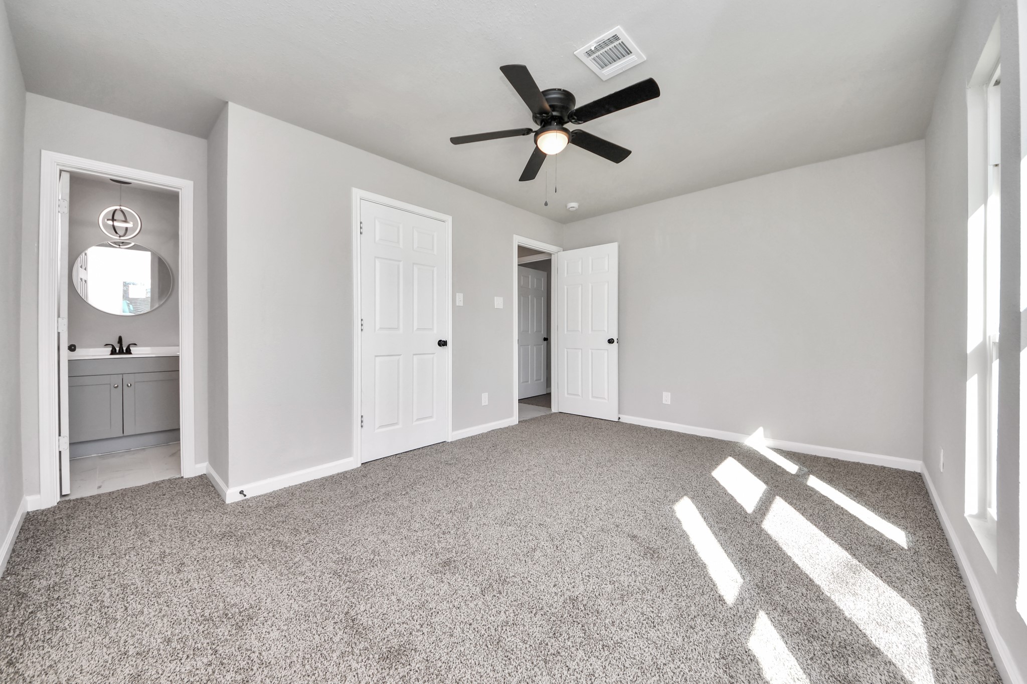 15123 Kaler Road Houston, TX 77060 - Photo 4 of 24 a view of a livingroom with a ceiling fan and window