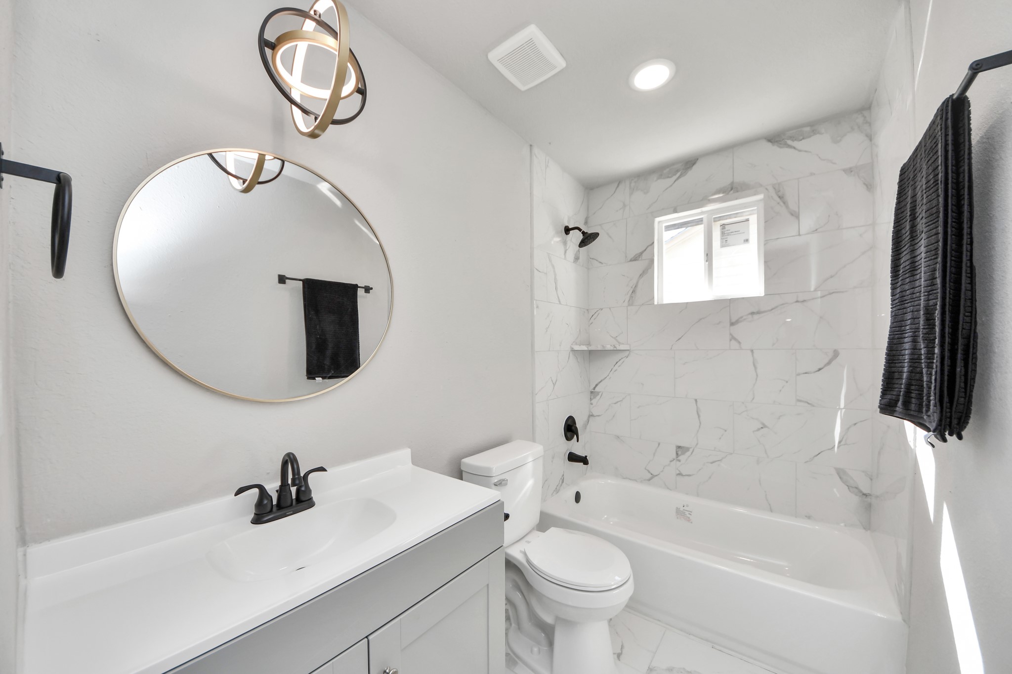 15123 Kaler Road Houston, TX 77060 - Photo 5 of 24 a bathroom with a sink a toilet and a mirror