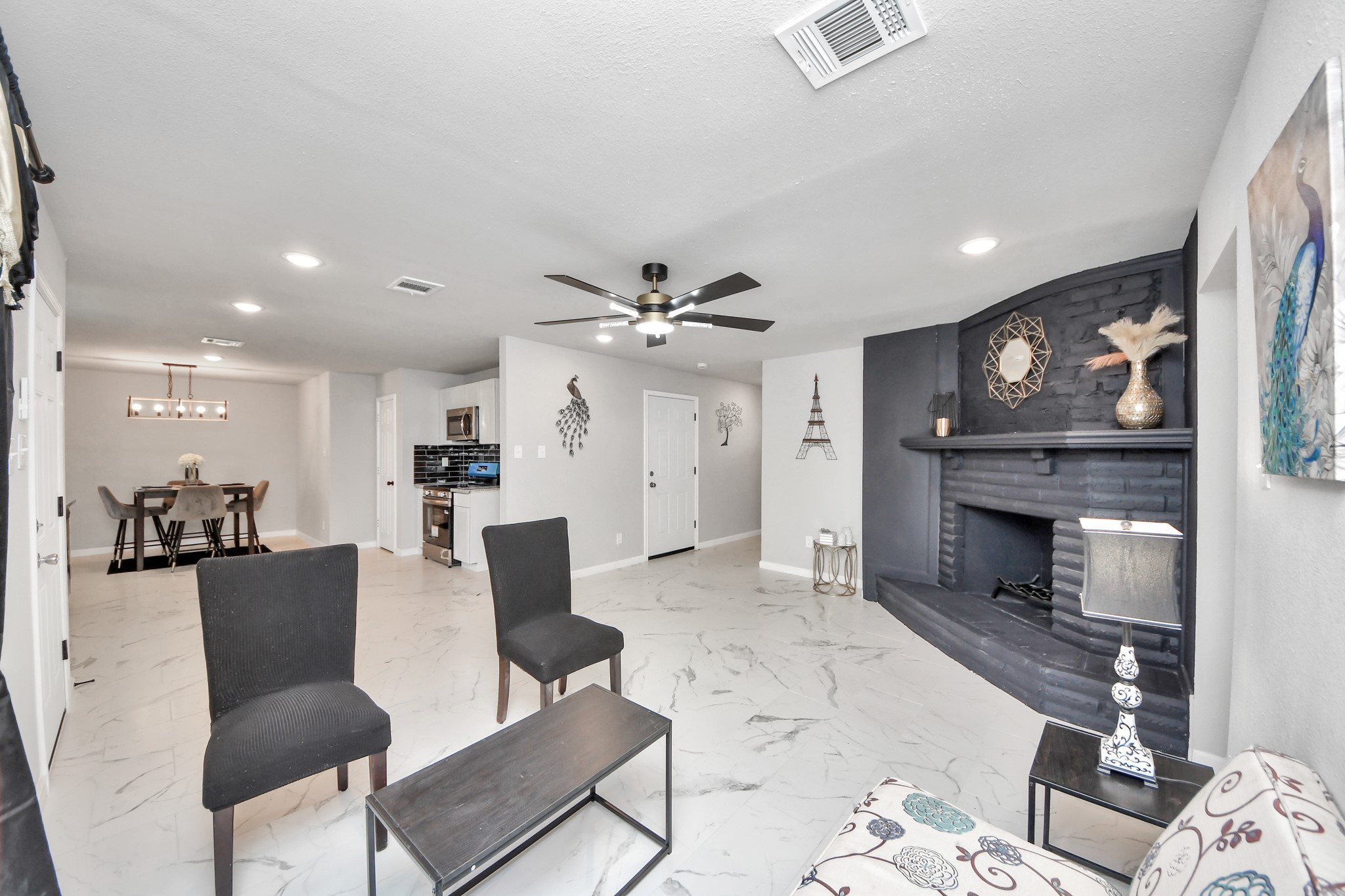 15123 Kaler Road Houston, TX 77060 - Photo 6 of 24 a living room with furniture and a fireplace