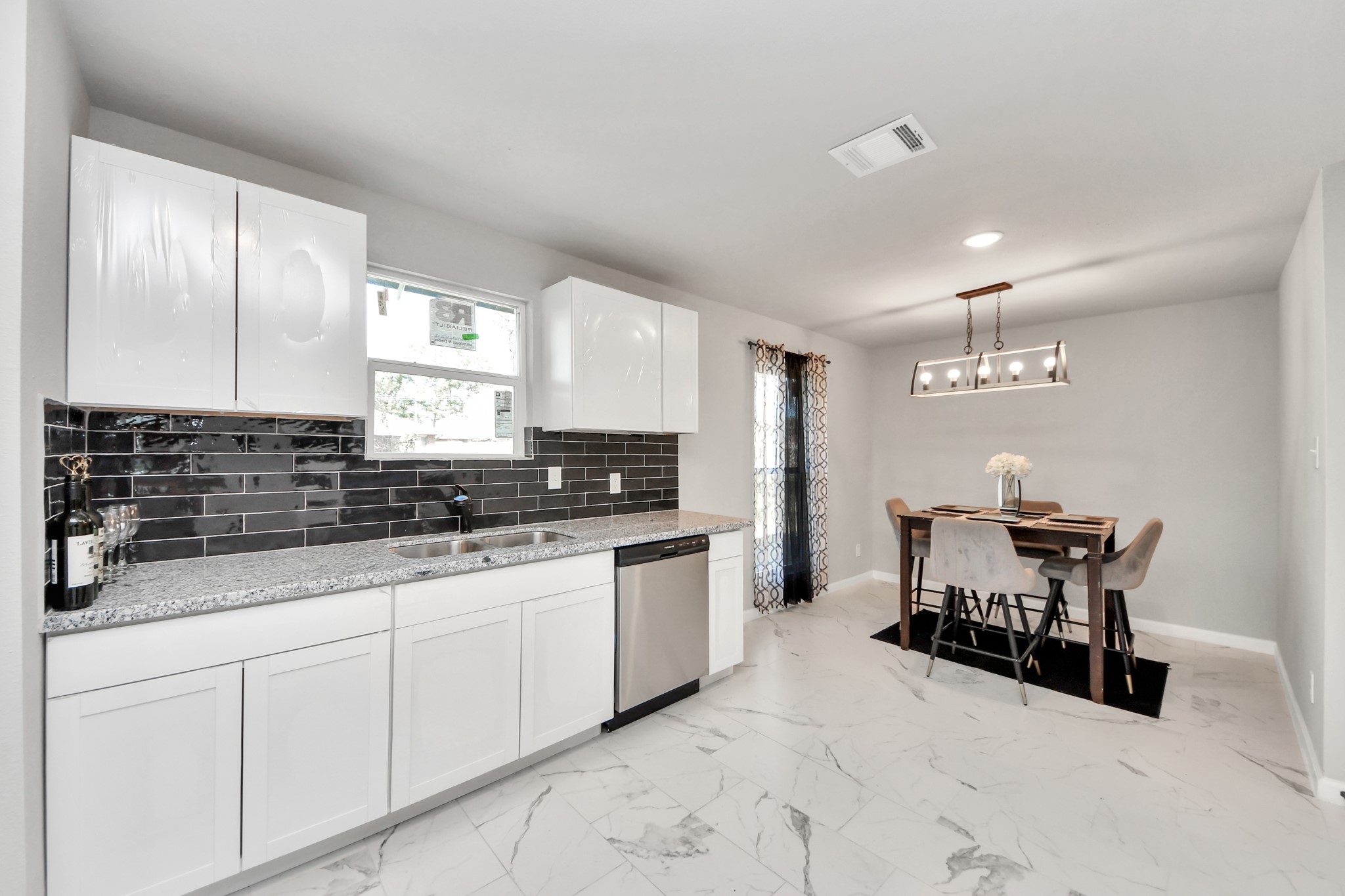 15123 Kaler Road Houston, TX 77060 - Photo 8 of 24 a kitchen with stainless steel appliances a sink stove and cabinets