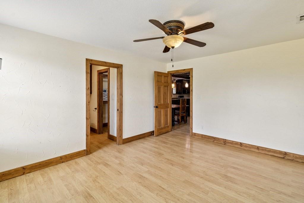 800 County Road 2807 Mabank, TX 75147 - Photo 26 of 40 an empty room with closet and ceiling fan