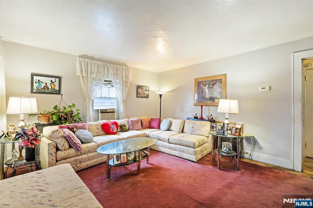 15 Victor Place Irvington, NJ 07111 - Photo 2 of 12 a living room with furniture and a rug