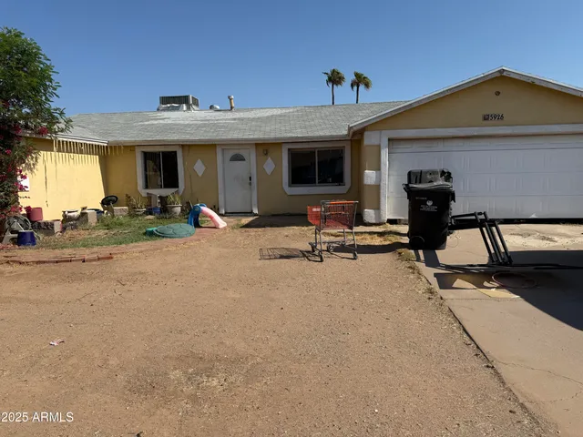a view of a house with sitting area and furniture
