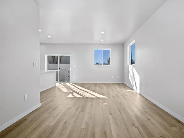 a bathroom with a toilet sink vanity and mirror