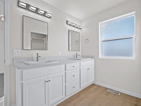 a bathroom with a shower and a sink