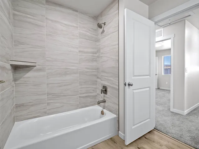 a view of a house with backyard and deck