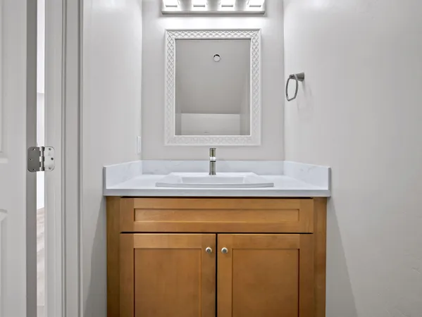 a bathroom with a sink and a mirror