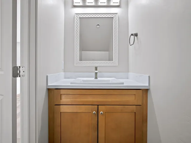 a bathroom with a sink and a mirror
