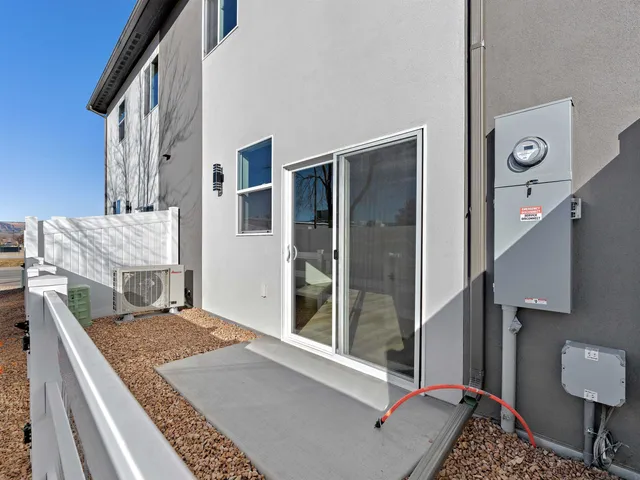 an aerial view of a house with a garden and lake view