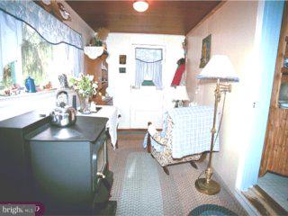 99 Gelsinger Road Sinking Spring, PA 19608 - Photo 4 of 6 a living room with furniture and wooden floor