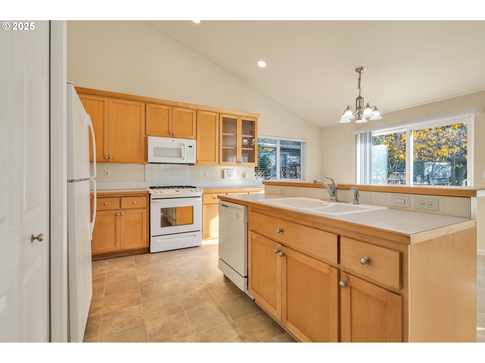 158 Mackin Avenue Eugene, OR 97404 - Photo 19 of 45 a kitchen with stainless steel appliances a sink stove and cabinets
