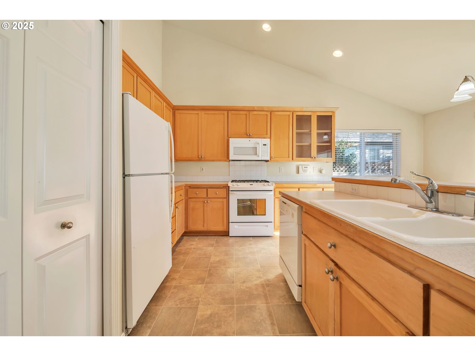 158 Mackin Avenue Eugene, OR 97404 - Photo 20 of 45 a kitchen with a sink appliances cabinets and a counter top space