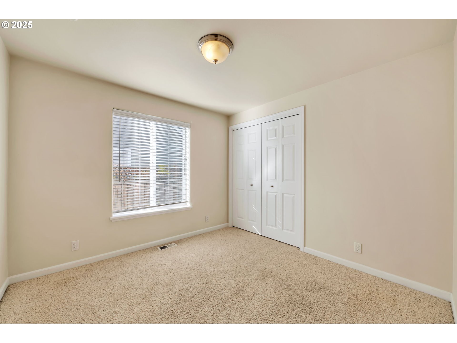 158 Mackin Avenue Eugene, OR 97404 - Photo 28 of 45 a view of an empty room with a window