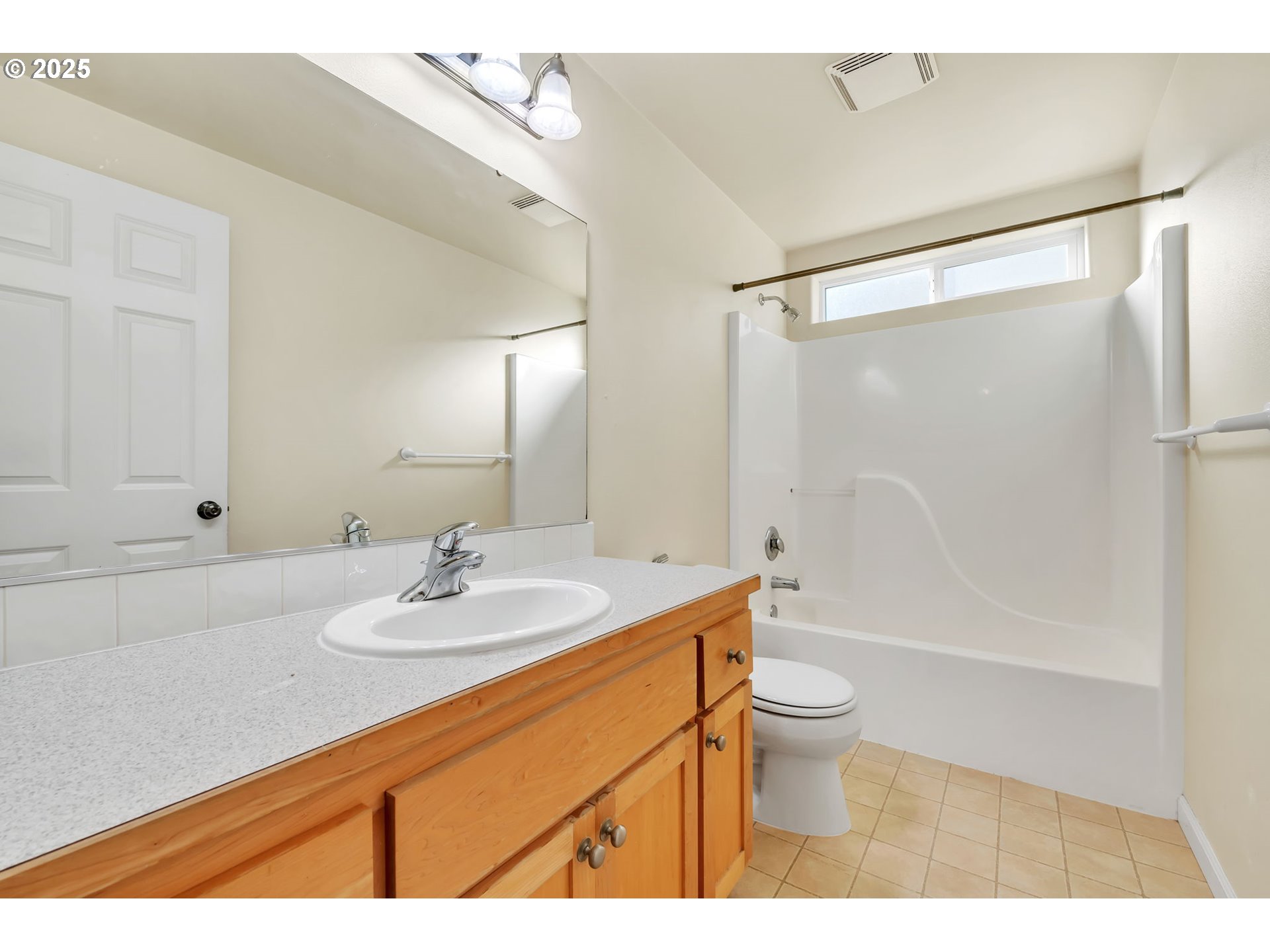 158 Mackin Avenue Eugene, OR 97404 - Photo 32 of 45 a bathroom with a sink a toilet and a large mirror