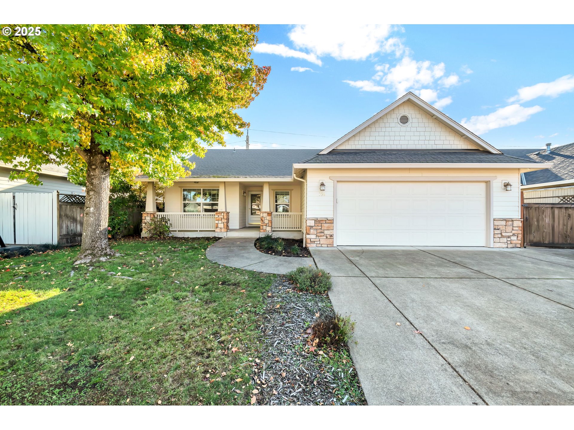 158 Mackin Avenue Eugene, OR 97404 - Photo 4 of 45 a front view of a house with a yard and garage