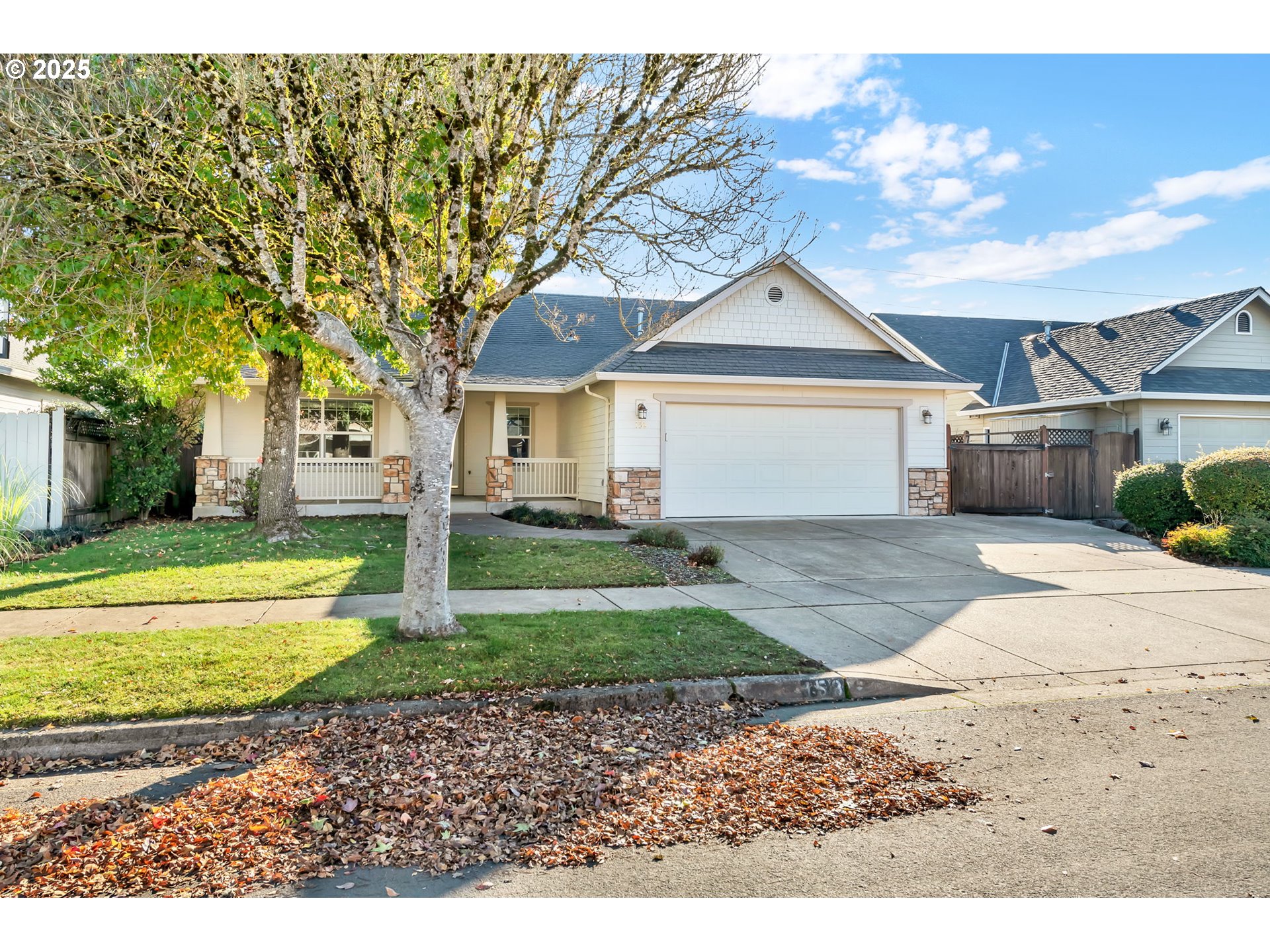 158 Mackin Avenue Eugene, OR 97404 - Photo 5 of 45 a front view of a house with a yard and garage
