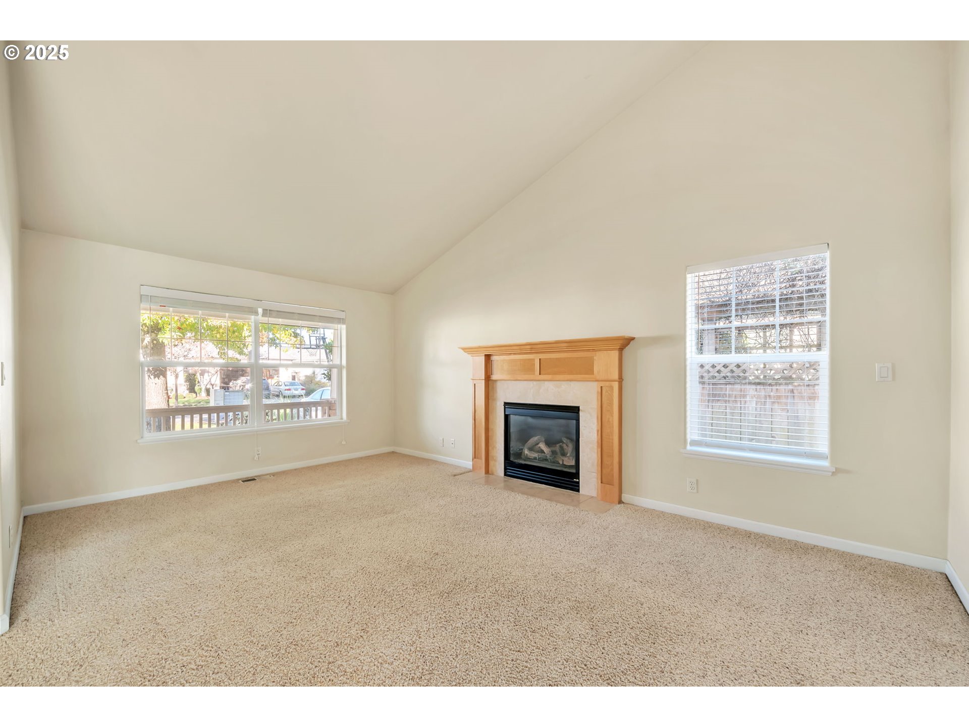 158 Mackin Avenue Eugene, OR 97404 - Photo 7 of 45 a view of an empty room with a fireplace and a window