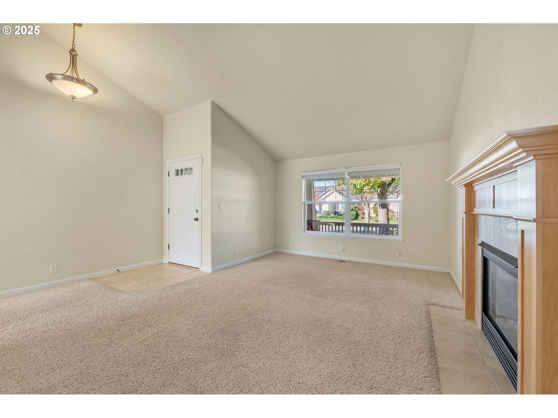 158 Mackin Avenue Eugene, OR 97404 - Photo 8 of 45 a view of an empty room with a fireplace and a window