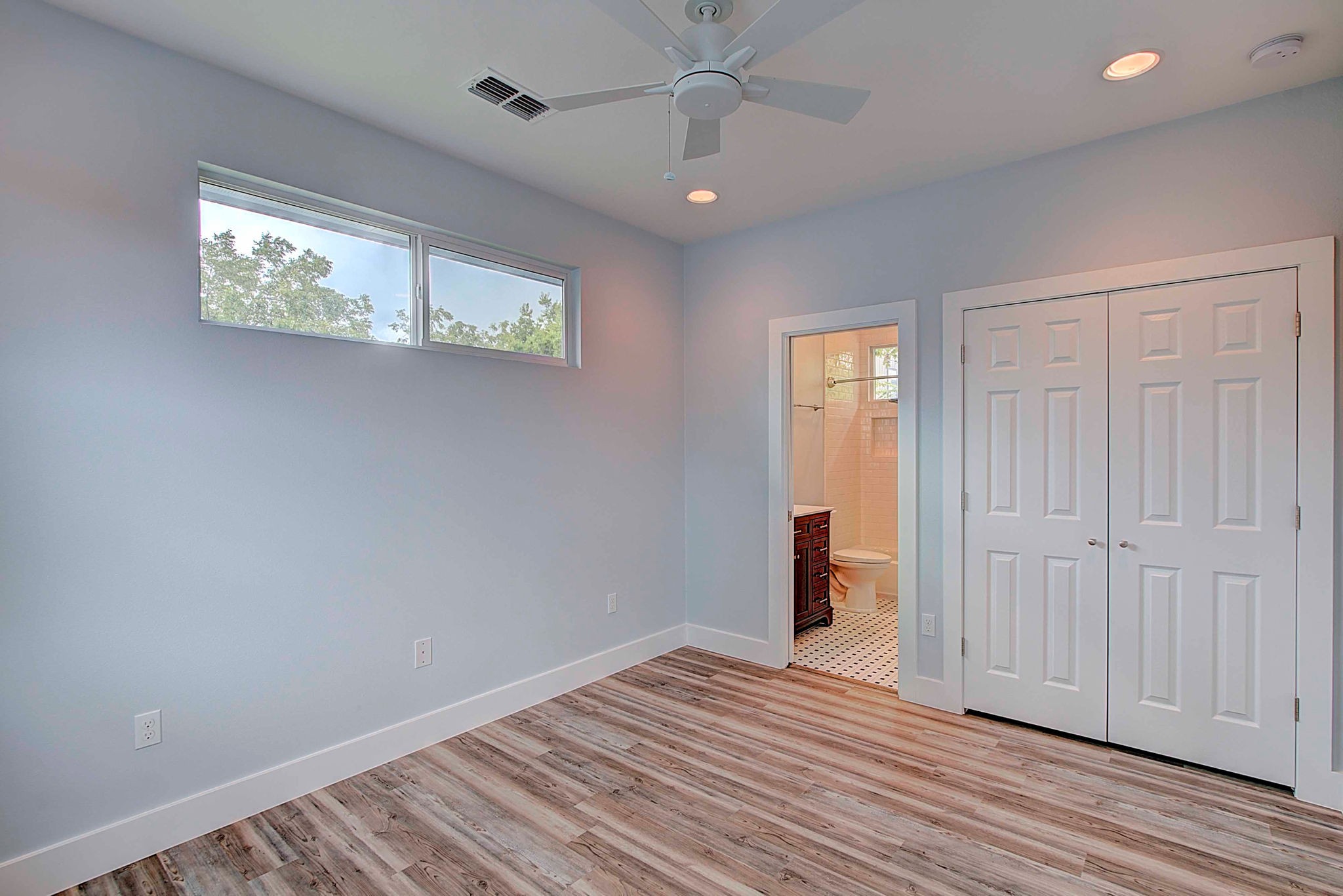 806 West Live Oak Street, Unit 2 Austin, TX 78704 - Photo 11 of 16 wooden floor in an empty room with a window