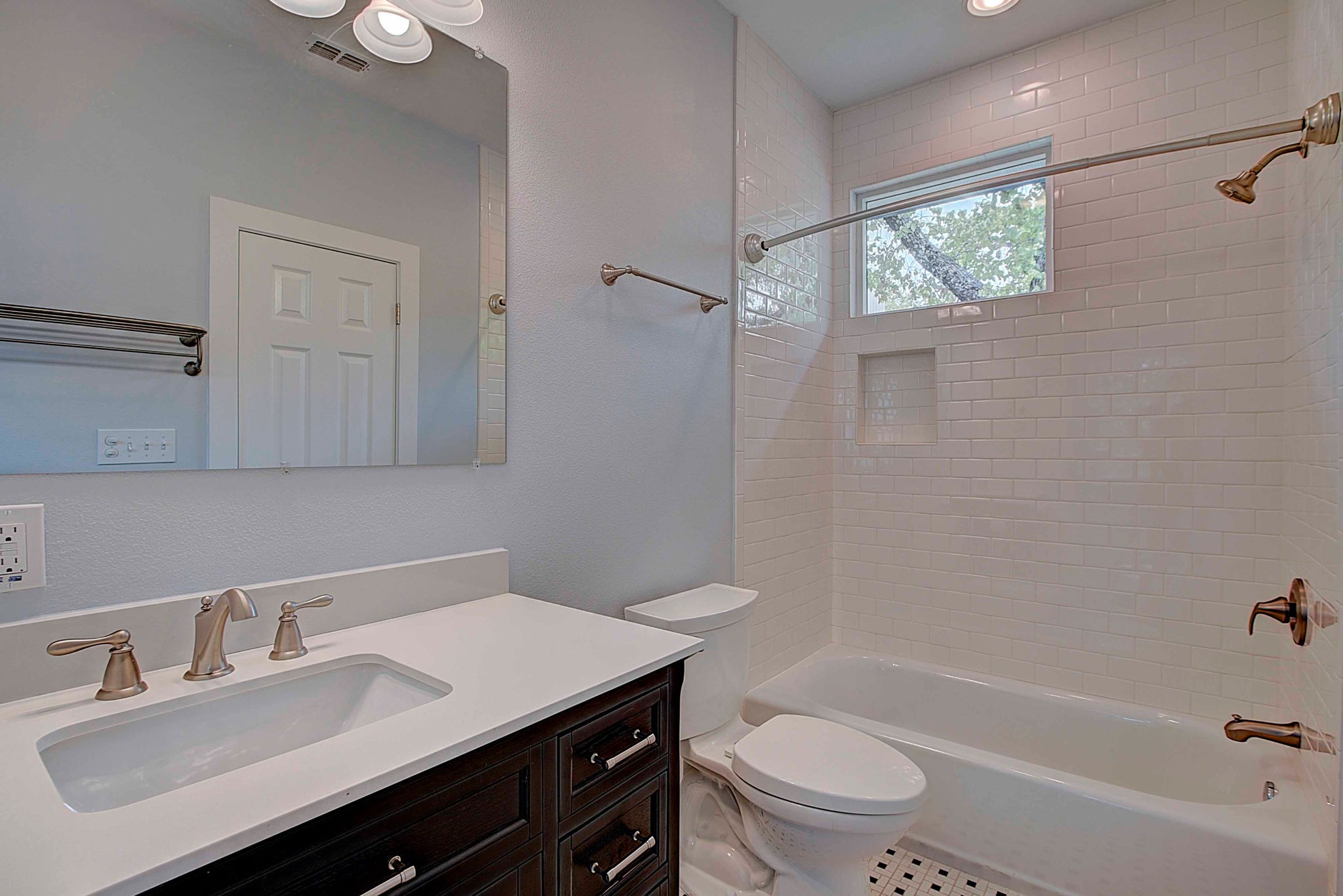 806 West Live Oak Street, Unit 2 Austin, TX 78704 - Photo 13 of 16 a bathroom with a sink toilet tub and shower