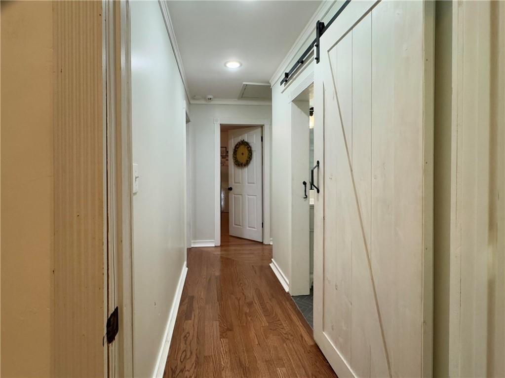 90 Howard Road Senoia, GA 30276 - Photo 33 of 73 a view of a hallway with wooden floor and staircase