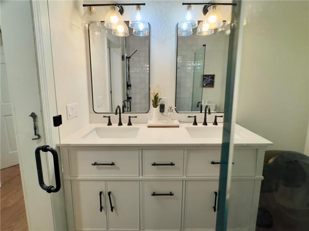 90 Howard Road Senoia, GA 30276 - Photo 34 of 73 a bathroom with a sink vanity and a mirror