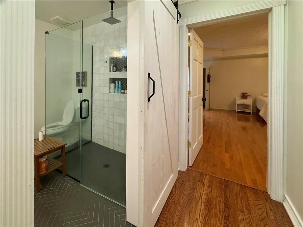 90 Howard Road Senoia, GA 30276 - Photo 38 of 73 a bathroom with a sink and a glass door shower