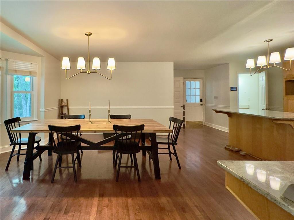90 Howard Road Senoia, GA 30276 - Photo 46 of 73 a view of a dining room with furniture and wooden floor