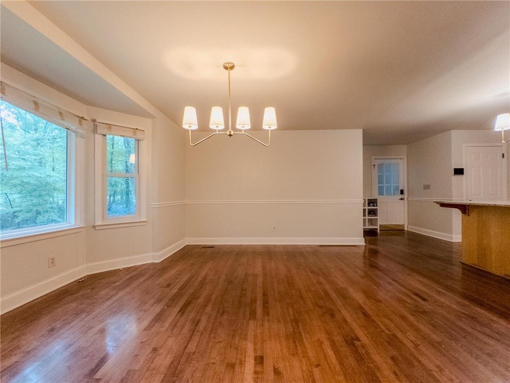 90 Howard Road Senoia, GA 30276 - Photo 52 of 73 an empty room with wooden floor and windows