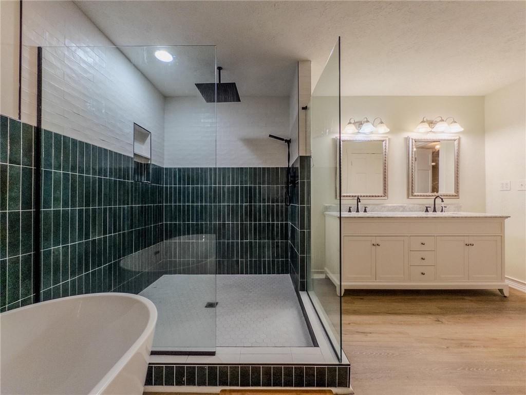 90 Howard Road Senoia, GA 30276 - Photo 57 of 73 a bathroom with a bathtub a sink a toilet a mirror and shower