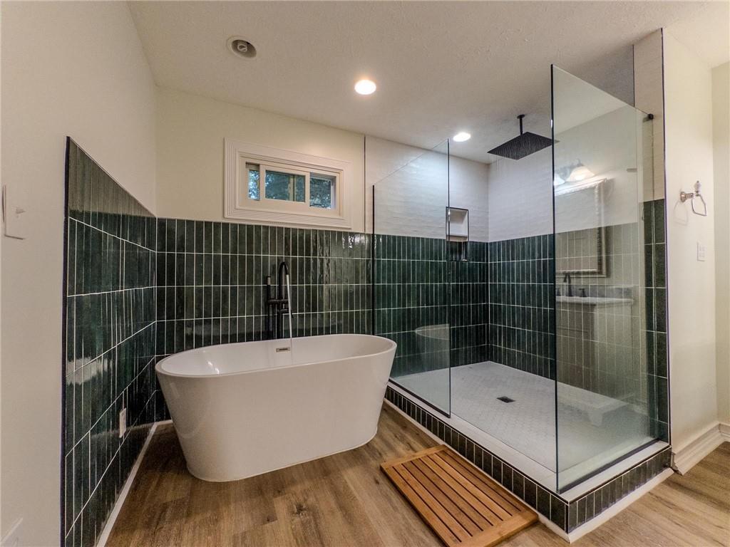 90 Howard Road Senoia, GA 30276 - Photo 58 of 73 a bathroom with a bathtub and shower