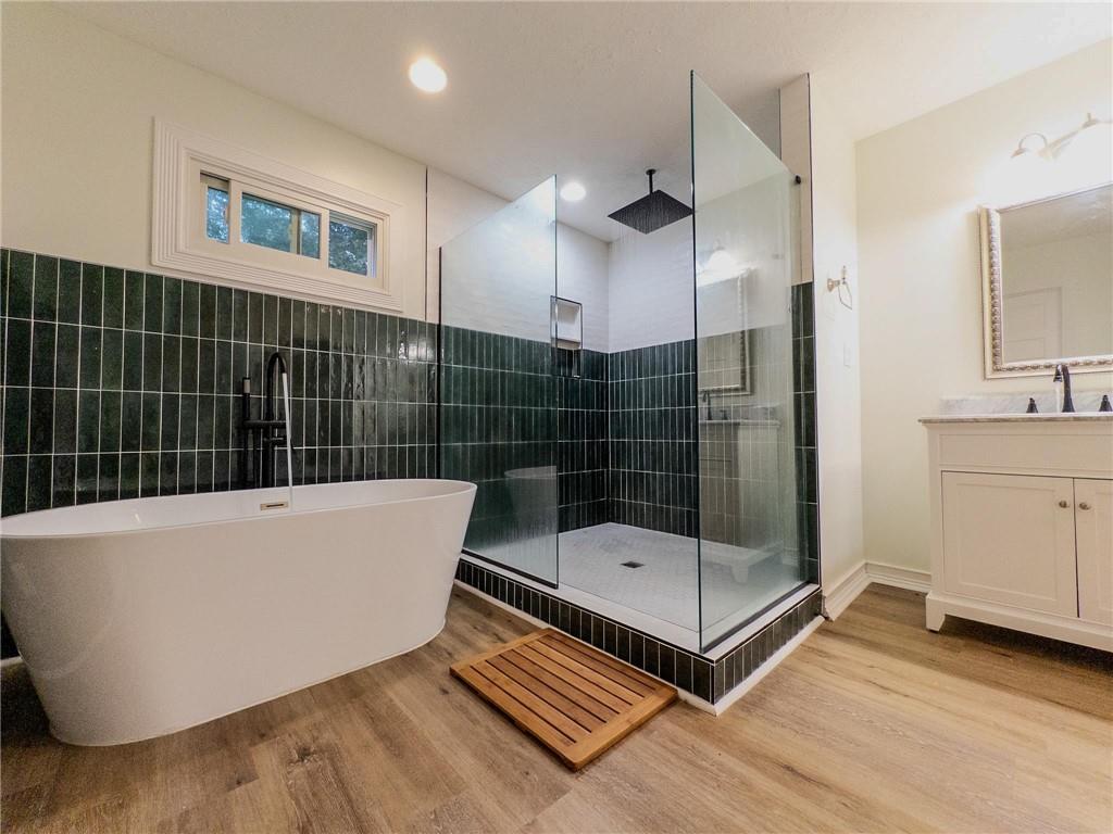 90 Howard Road Senoia, GA 30276 - Photo 59 of 73 a bathroom with a tub and a shower