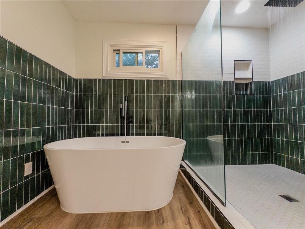 90 Howard Road Senoia, GA 30276 - Photo 60 of 73 a view of a bathroom with a bathtub