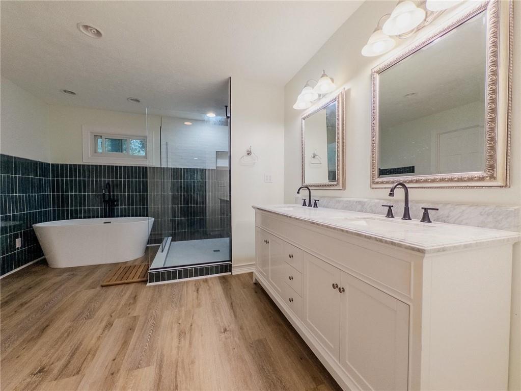 90 Howard Road Senoia, GA 30276 - Photo 6 of 73 a bathroom with a sink a mirror and a shower