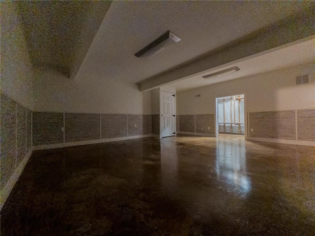 90 Howard Road Senoia, GA 30276 - Photo 65 of 73 a view of empty room with wooden floor