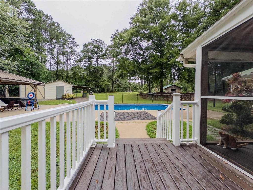 90 Howard Road Senoia, GA 30276 - Photo 73 of 73 a view of a deck with wooden floor and fence next to a yard