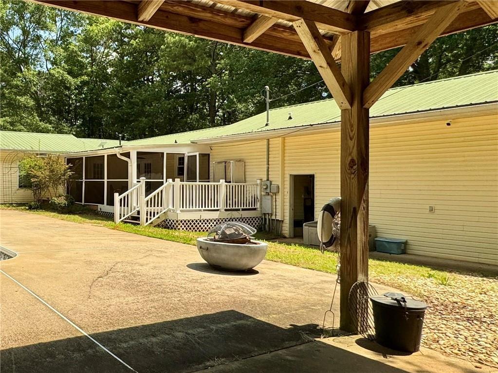 90 Howard Road Senoia, GA 30276 - Photo 10 of 73 a view of a patio with table and chairs and potted plants